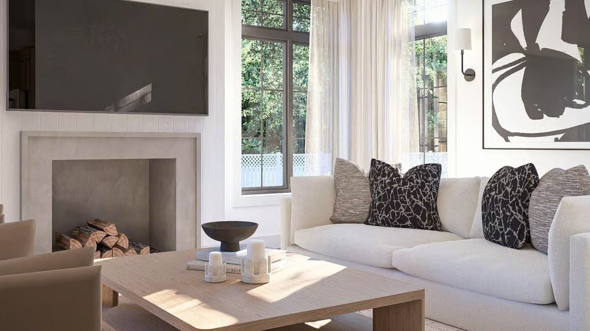 Concrete Fireplace Surround and Cream Upholstery Set the Tone Here