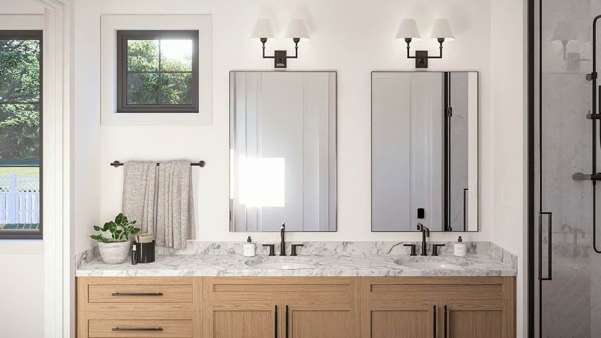 Double Vanity With Black Hardware and Marble Counters Earns Its Keep