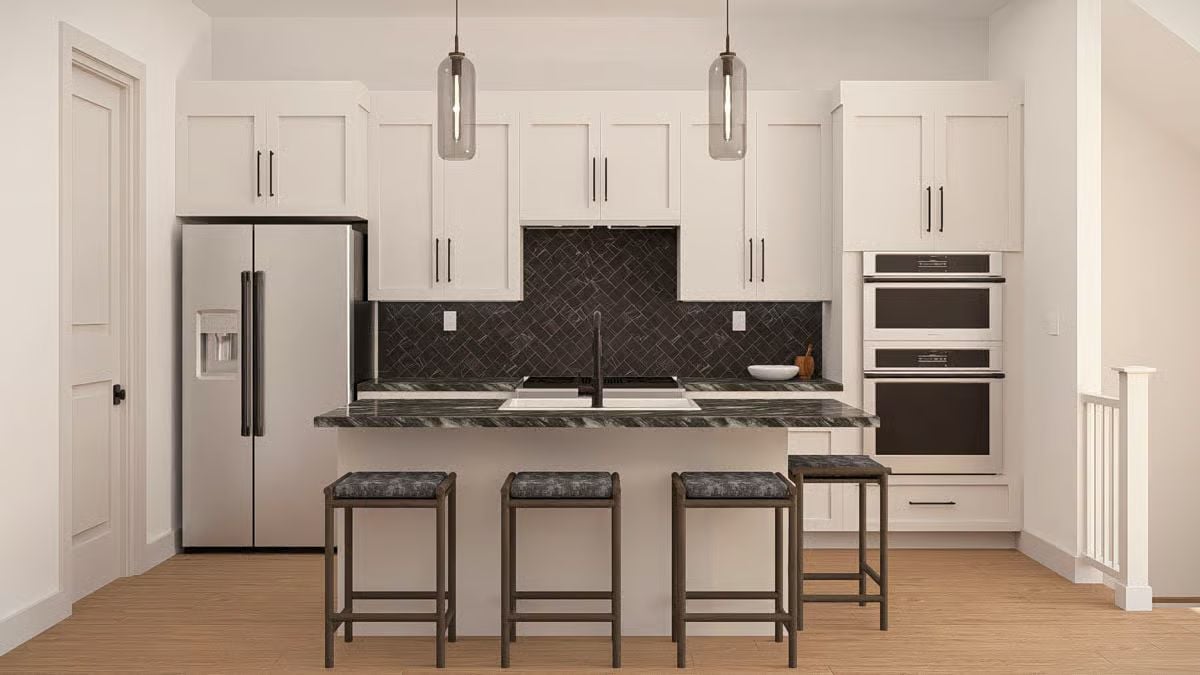 Dark Countertops and Pendant Lights That Know Their Place