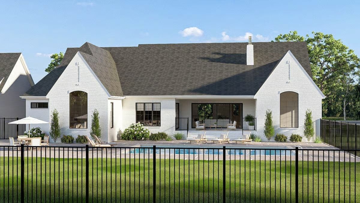 White Brick Exterior with Pool Patio and Arched Window Accents