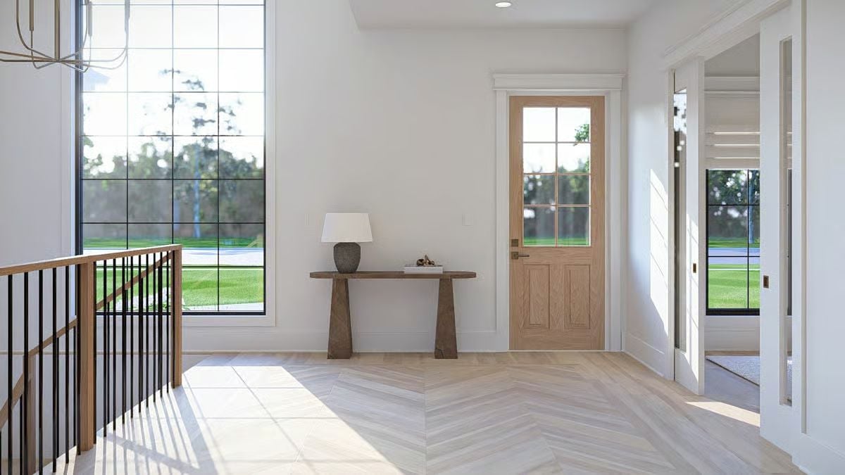 Chevron-Pattern Entry Hall with Natural Wood Door and Console