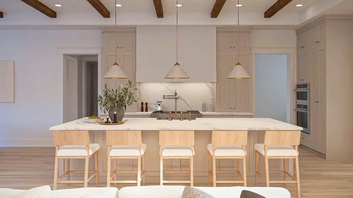 Marble Island Kitchen Where Brass Fixtures and Wood Beams Do the Heavy Lifting