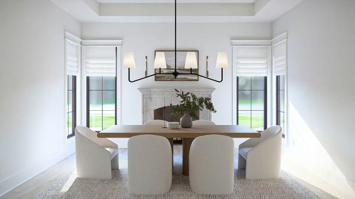 Curved Dining Chairs and a Marble Fireplace Make This Room Feel Earned