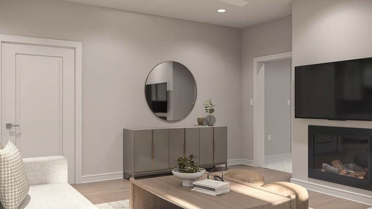 Round Mirror and Sideboard Turn a Plain Wall Into the Room's Focal Point
