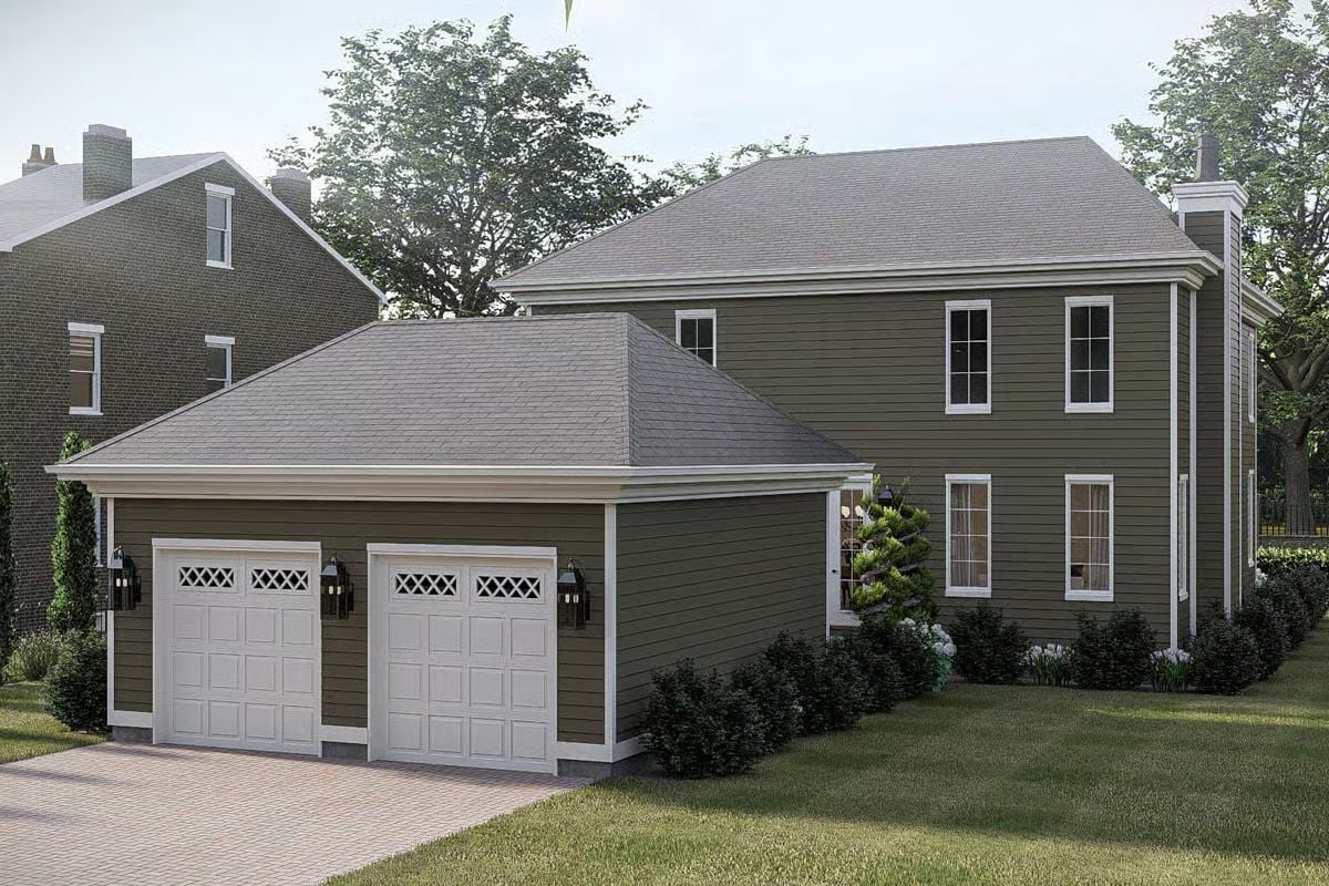 Olive Siding and White Garage Doors Give This Colonial Side Elevation Real Curb Appeal