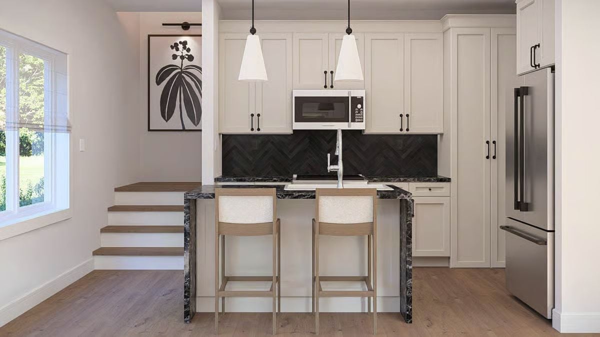 Marble Waterfall Counters and a Herringbone Backsplash Do the Heavy Lifting Here