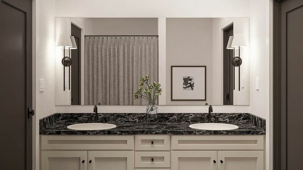 Dark Marble and Warm Sconces Make This Double Vanity Worth the Splurge