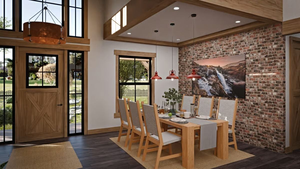 Red Barn Pendants and Exposed Brick Define the Dining Room's Personality