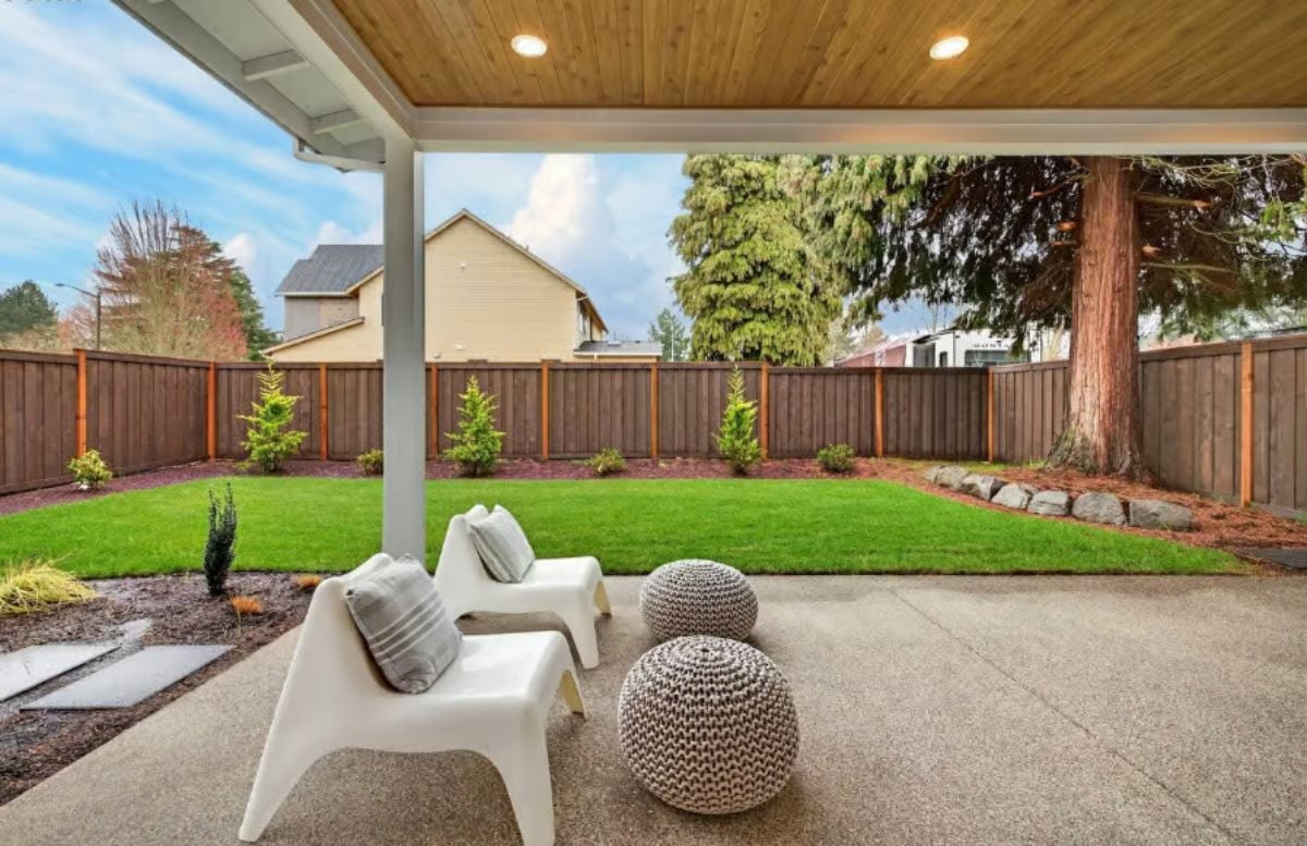 Covered Patio With Wood Ceiling and Clean Backyard Views