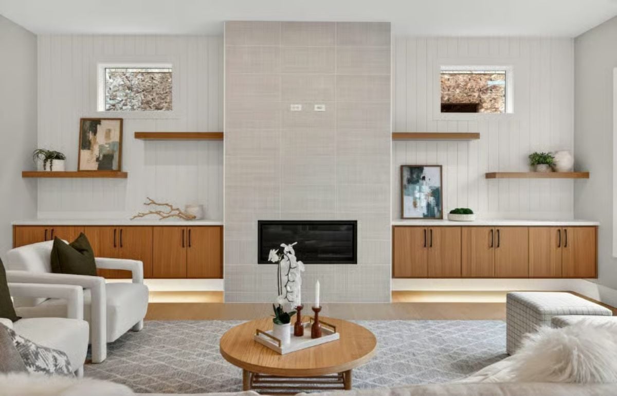 Floating Cabinets and Floor-Level Lighting Give This Fireplace Wall Its Edge