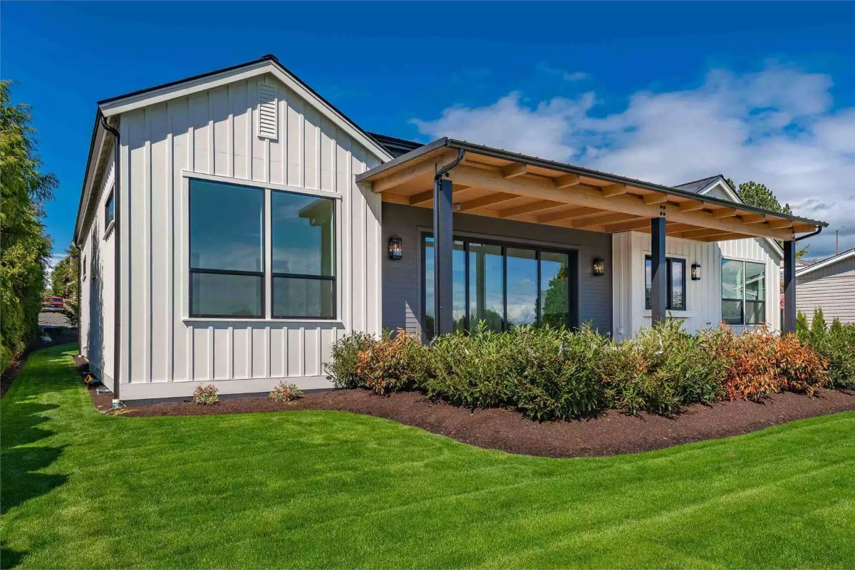 Covered Deck and Board-and-Batten Exterior on a Well-Kept Corner Lot