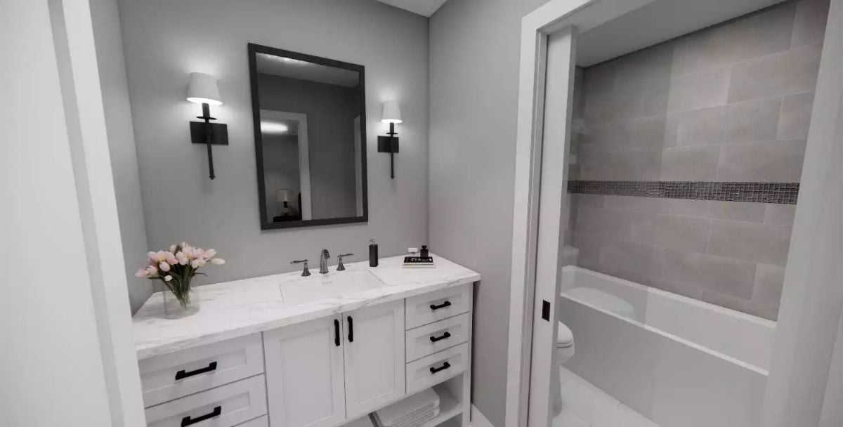 Marble Countertop, Sconce Lighting, and a Vanity Built to Last