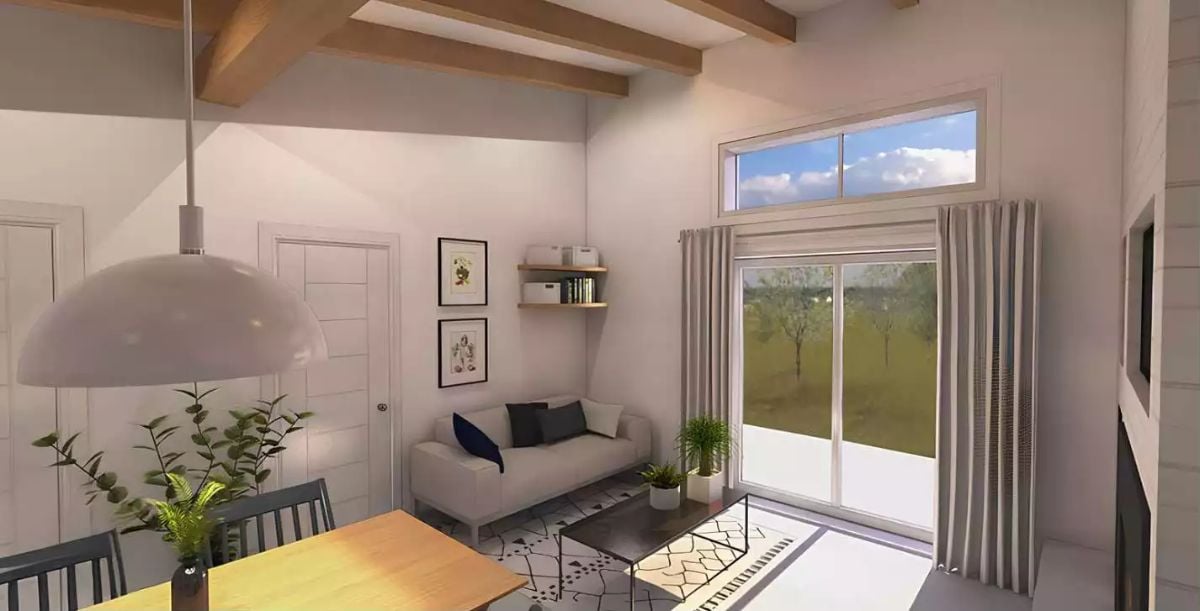 Exposed Beams, Sliding Glass, and a Living Room That Earns Its Light
