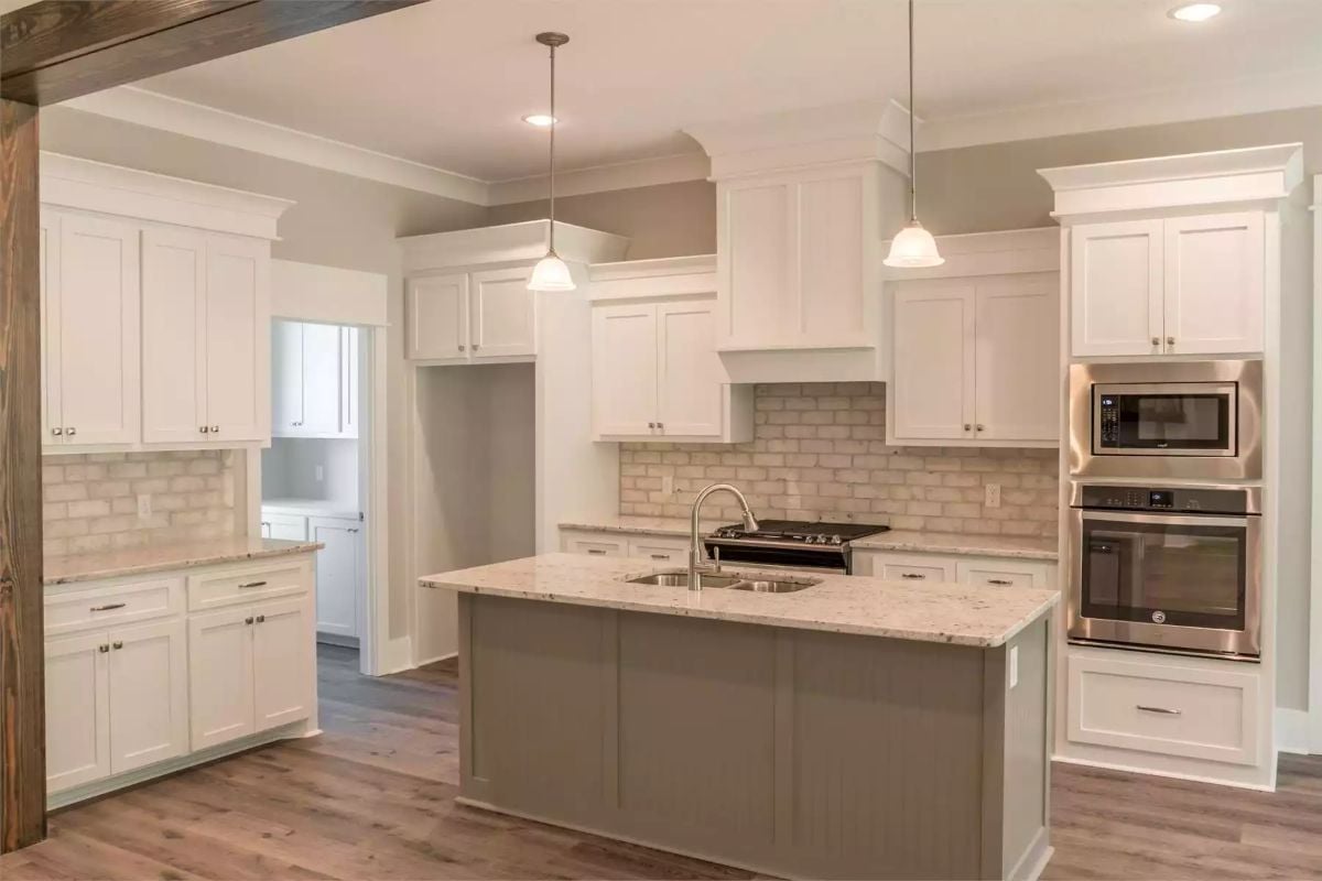 Greige Island Base and Granite Countertops Give This Kitchen Its Quiet Confidence