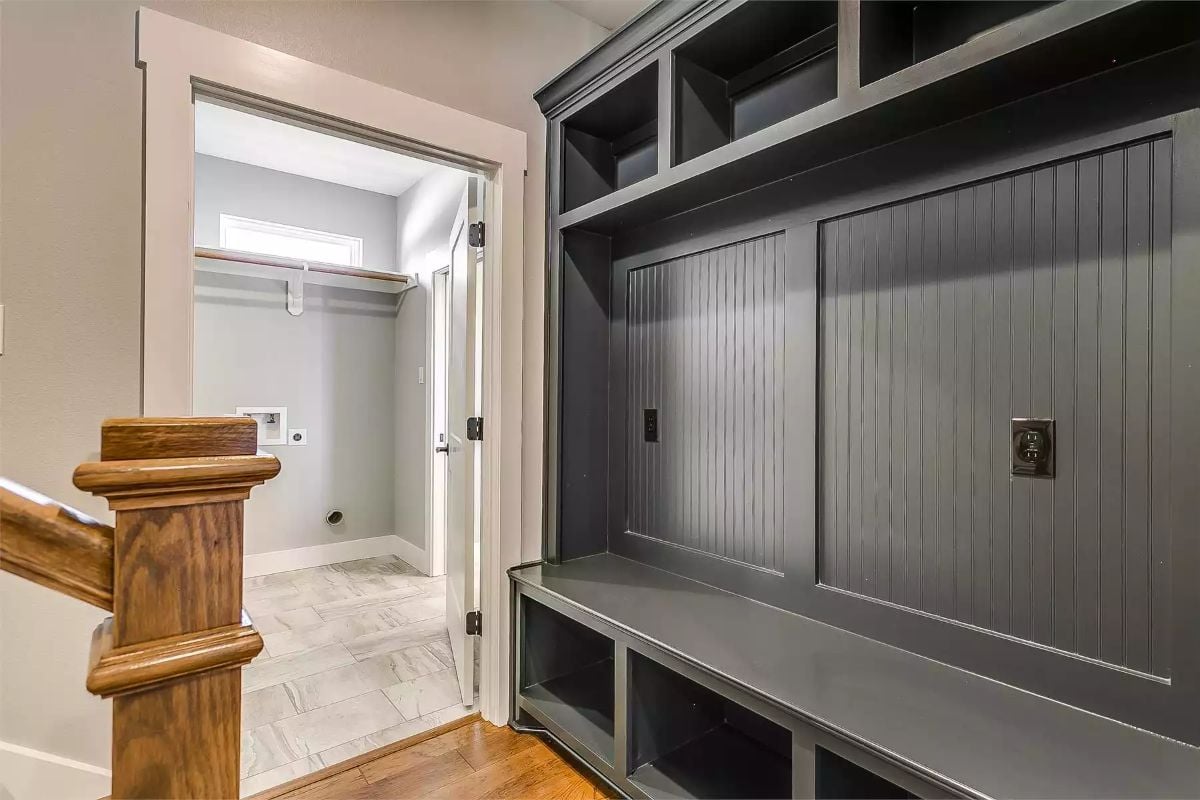 Dark Built-Ins and Beadboard Backing Make a Mudroom Feel Intentional