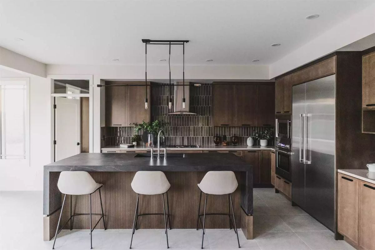 Dark Cabinets, Stone Countertops, and Pendant Lights That Don't Overdo It