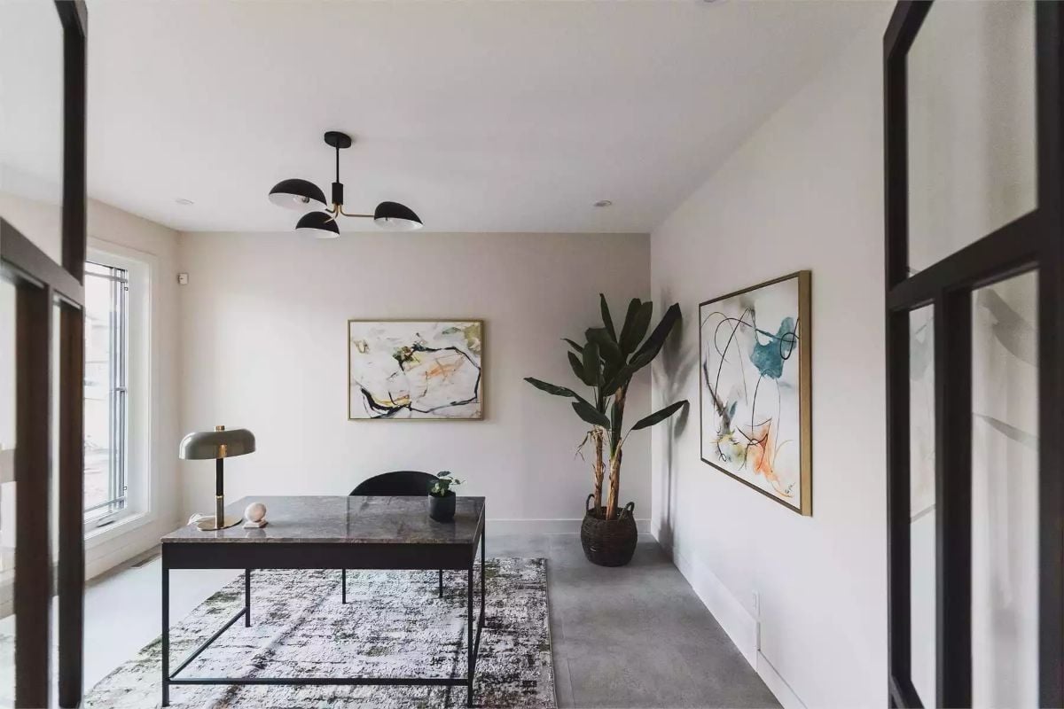 Framed Art, a Tall Plant, and a Desk That Means Business