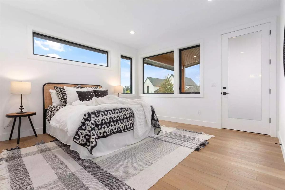 Black-Framed Windows, Rattan Headboard, and Bedding That Earns Its Pattern