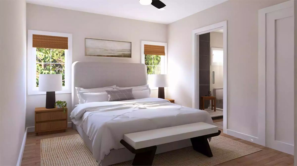 Upholstered Headboard and Bamboo Shades Keep This Primary Bedroom Grounded