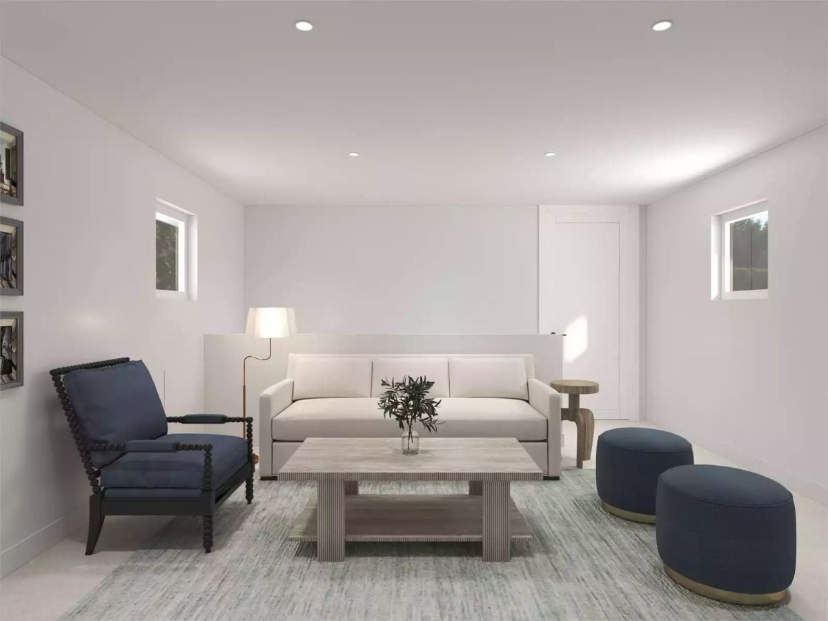 Navy Ottomans and a Spindle Chair Give This Basement Living Room Real Character