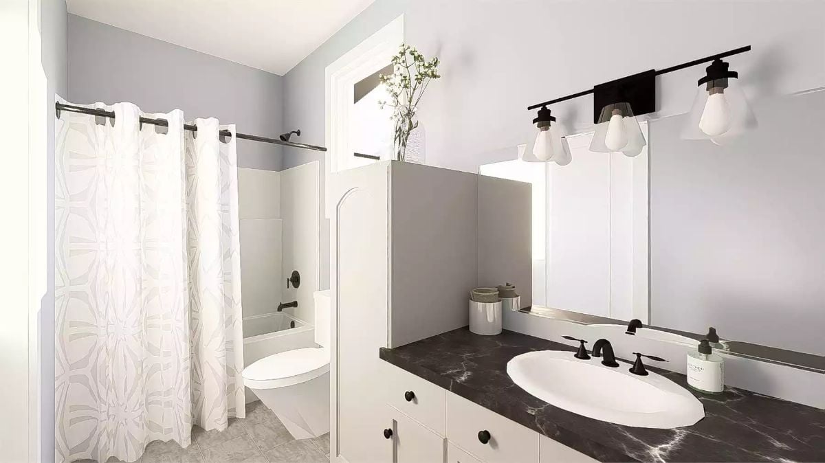 Dark Marble Countertop Grounds an Otherwise All-White Bathroom