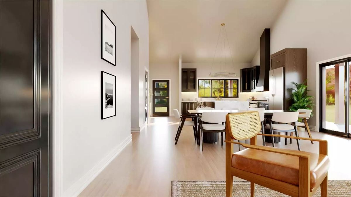 Warm Wood and Black Cabinetry Pull This Open-Plan Interior Together