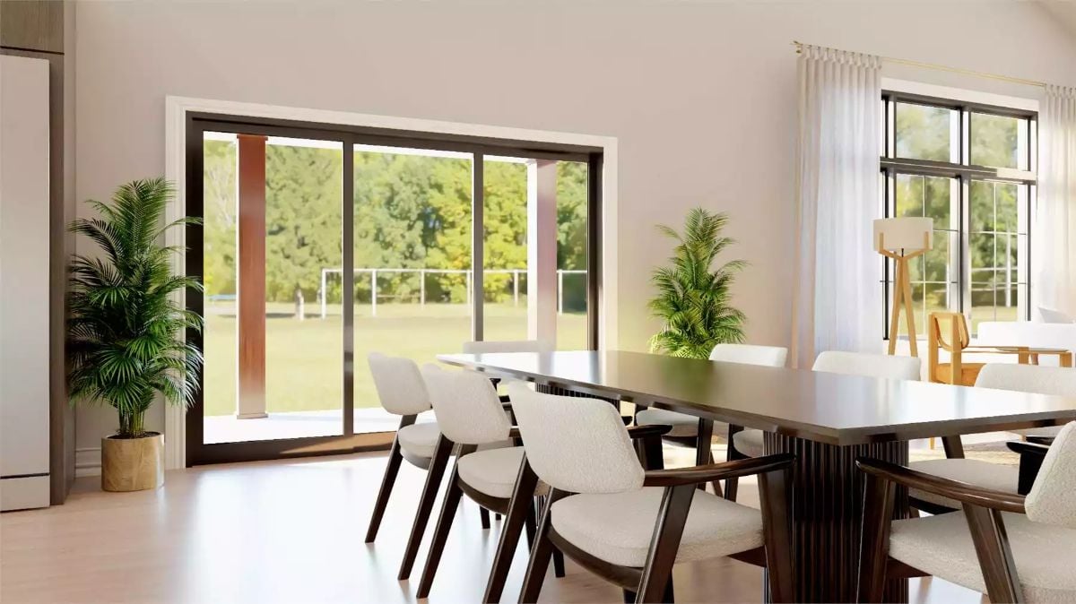 Sliding Glass Doors and Dark Wood Furniture Give This Dining Room Serious Presence