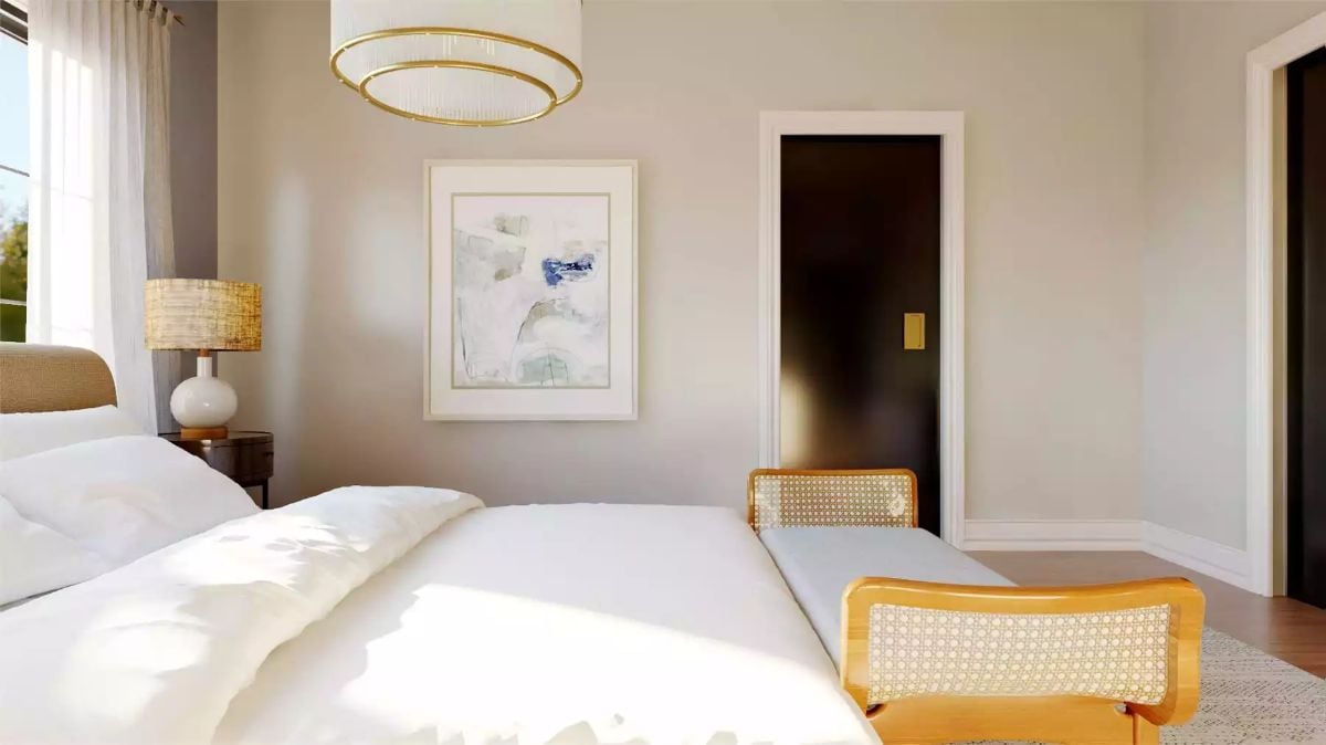 Gold Hardware and Rattan Bench Ends Give This Bedroom Real Warmth