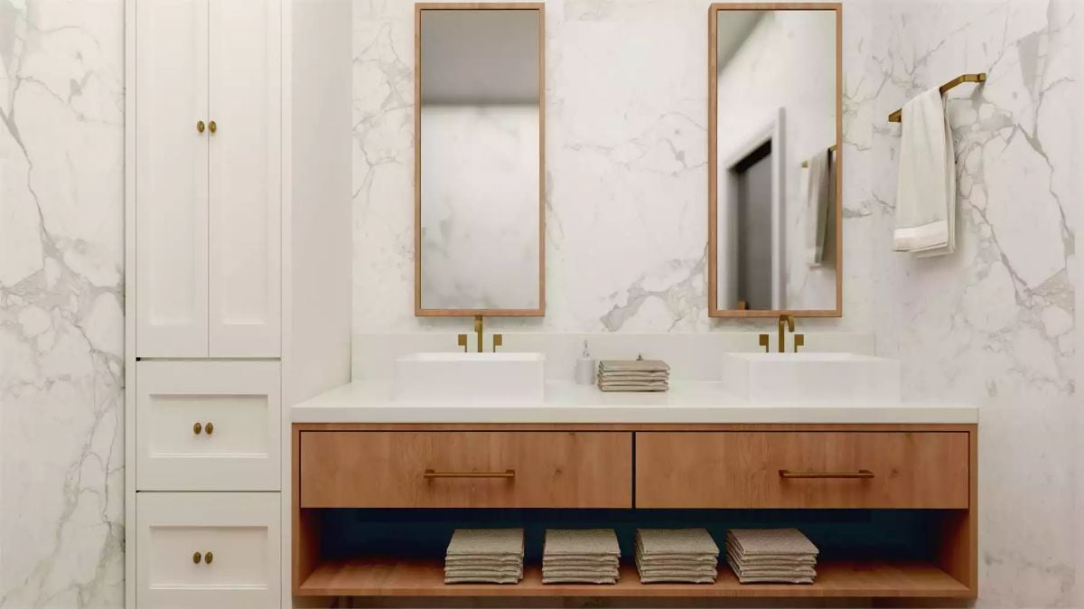 Warm Wood Vanity and Brushed Gold Hardware Make This Double Sink Worth Lingering In