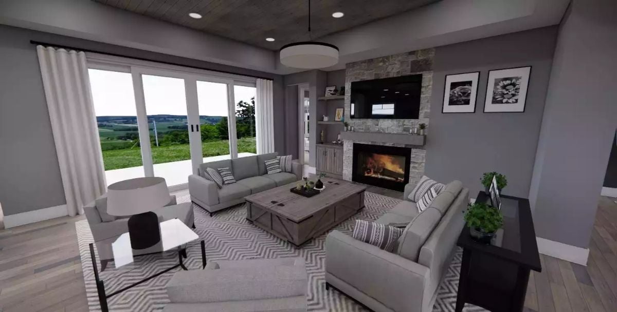 Stone Fireplace Wall Anchors a Gray Living Room With Countryside Views