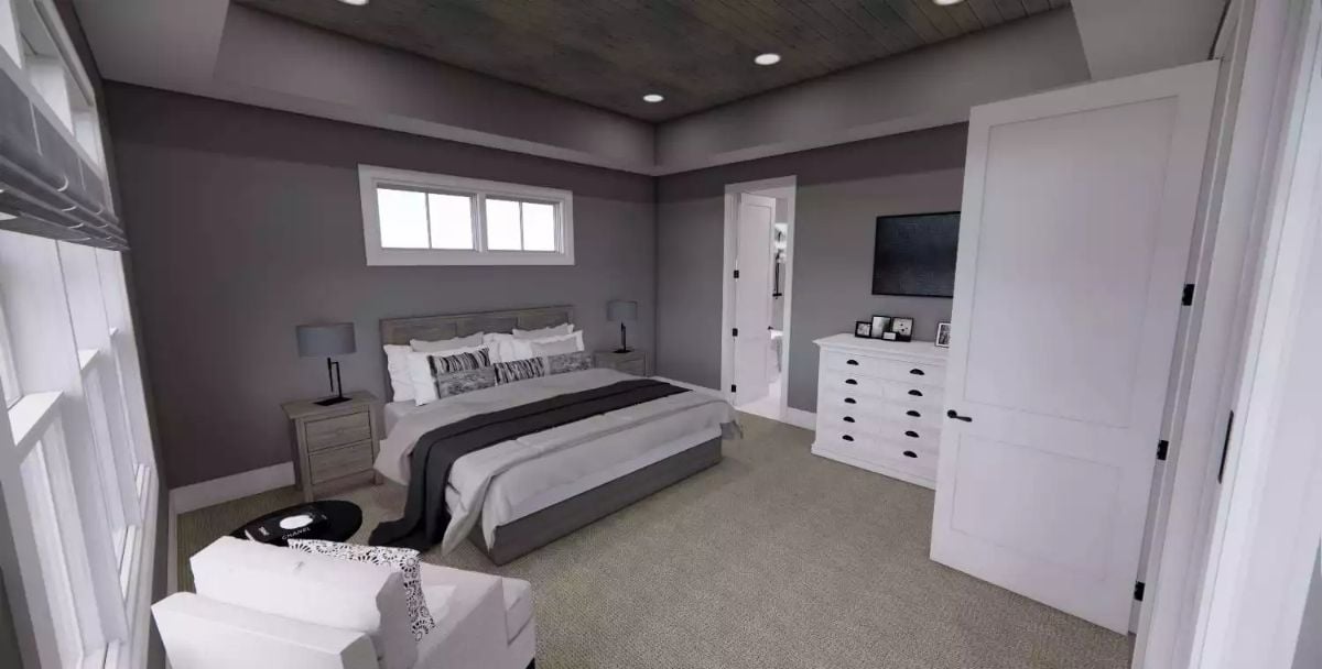 Dark Wood Ceiling Gives This Basement Bedroom Its Own Identity