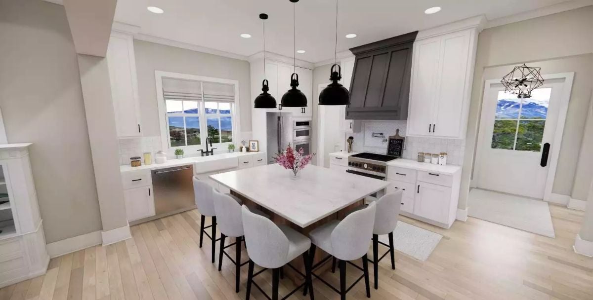 Dark Range Hood and Black Pendants Pull Focus in a White Farmhouse Kitchen