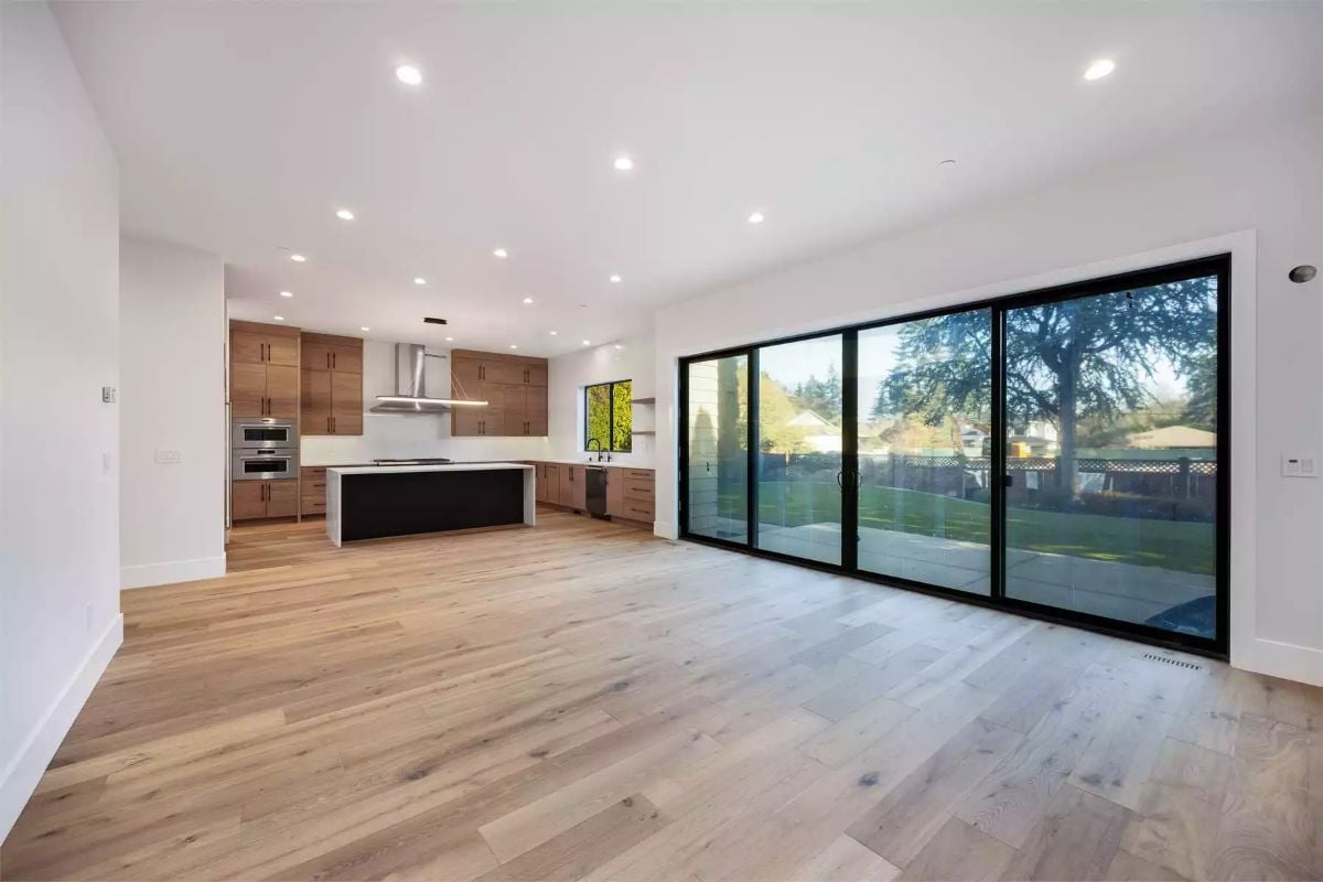 Sliding Glass Walls and a Kitchen Island That Commands the Room