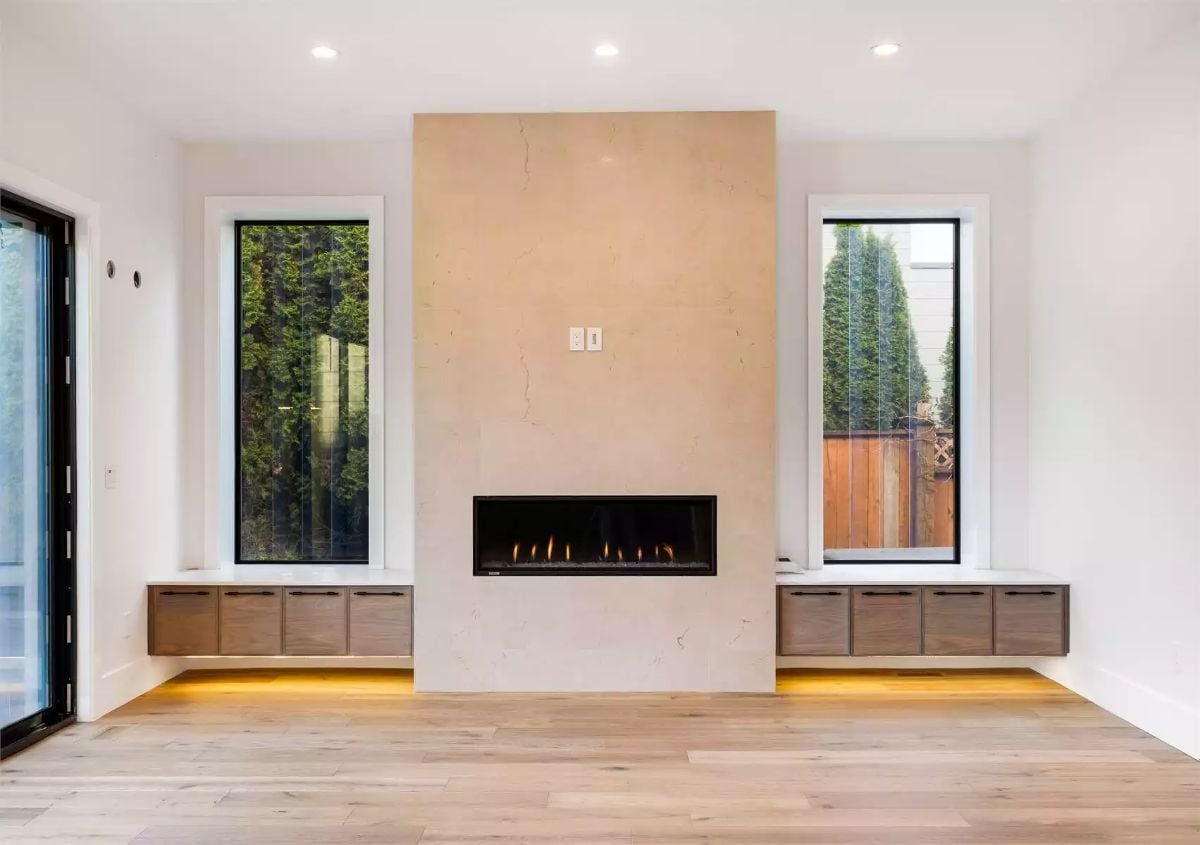 Marble Surround, Floating Cabinets, and a Linear Fireplace That Anchors the Room
