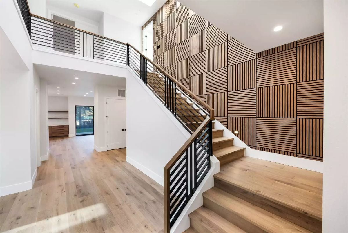 Acoustic Wood Panels and a Staircase That Earns Its Wall Space