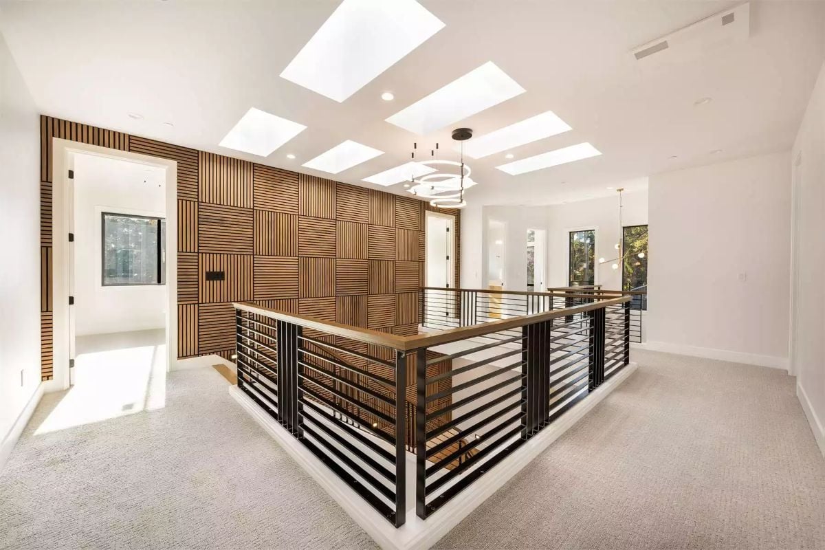 Skylights, Slatted Wood, and a Hallway That Pulls You Forward