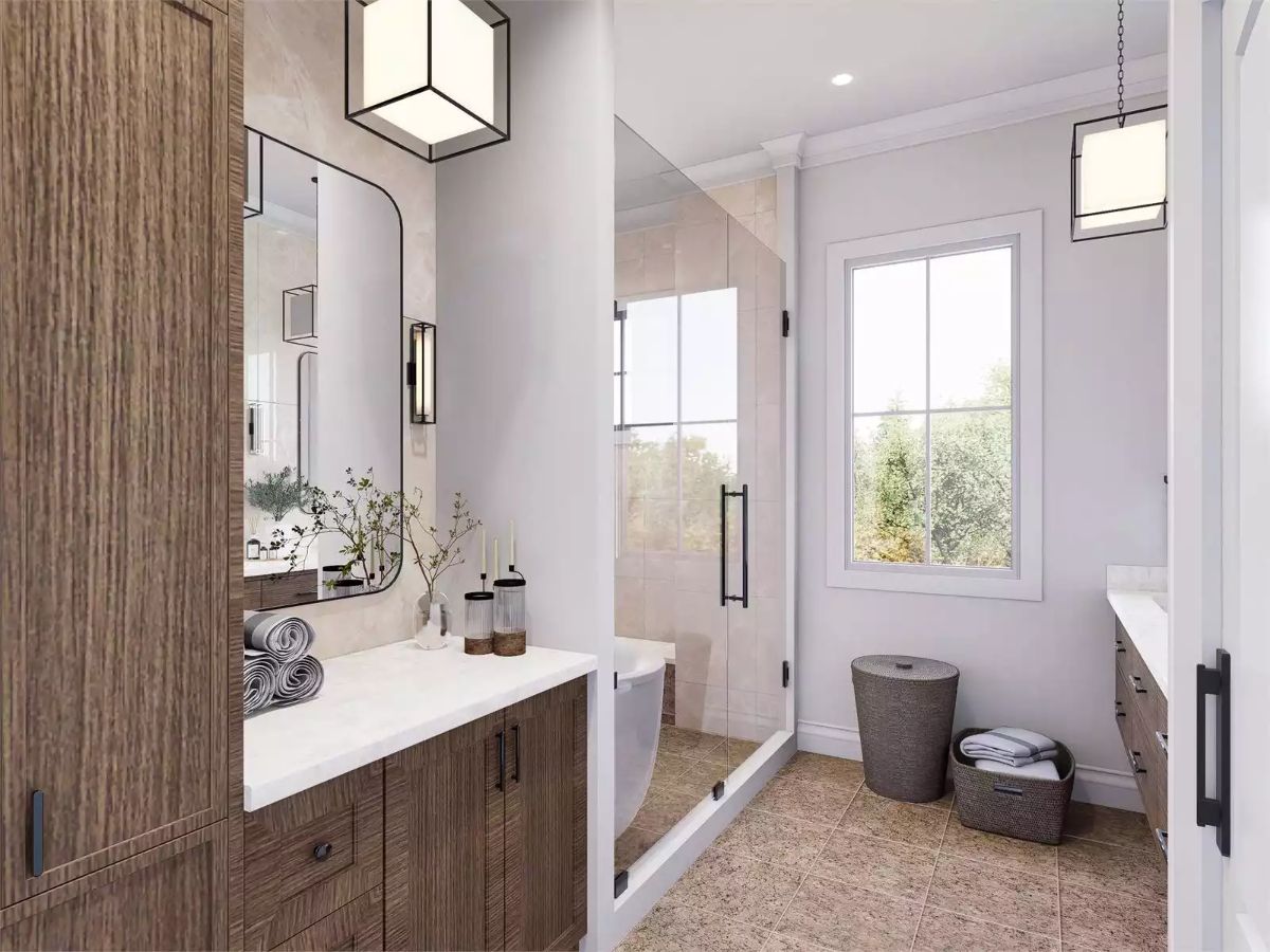 Wood-Toned Vanity and Glass Shower Make Good Use of Natural Light