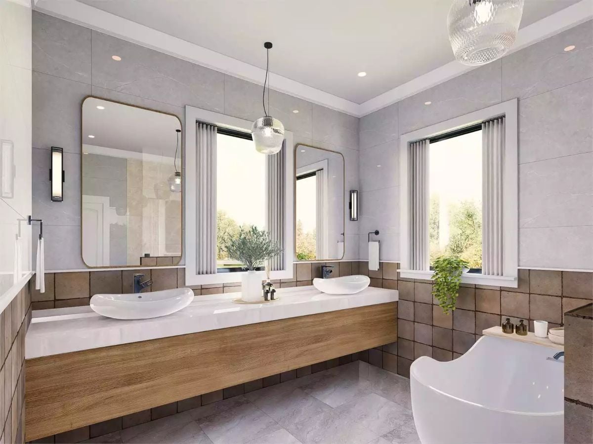 Vessel Sinks and Warm Wood Cabinetry Pull Double Duty in This Shared Bath