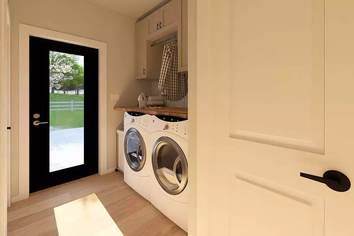 Plaid Shirt on a Rod and a Wood Countertop Make This Laundry Room Feel Lived In