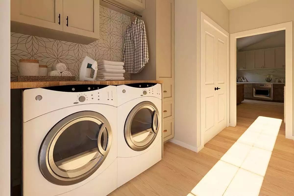 Folded Towels, an Iron, and Sunlight Streaming Across a Laundry Room Done Right