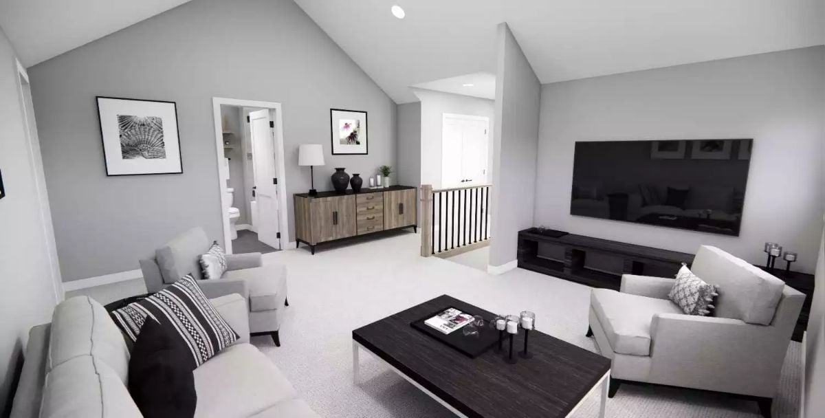 Vaulted Loft with TV Wall Pulls Double Duty as Lounge and Bonus Room