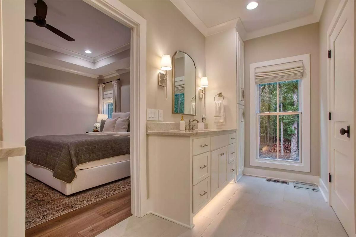 Warm Sconces and Under-Cabinet Glow Make This Ensuite Feel Like Its Own Room