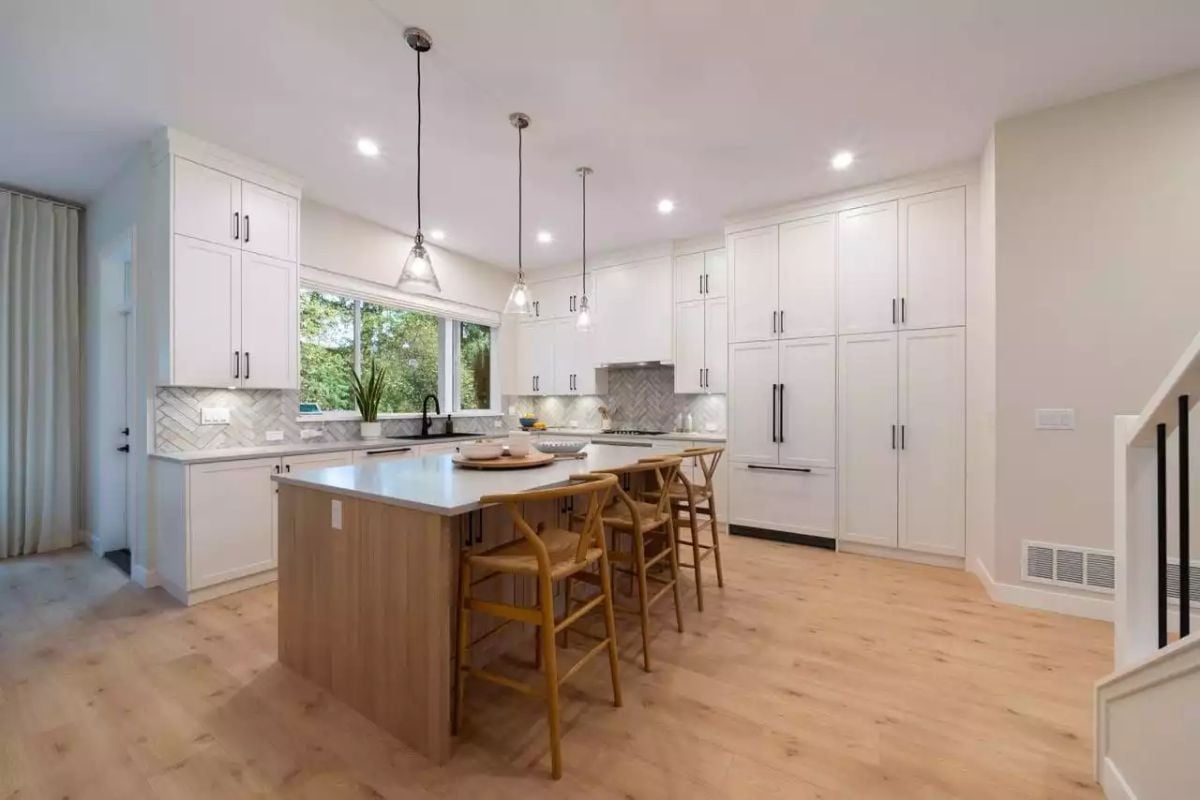 Wishbone Bar Stools and a Wood Island Base Anchor This Kitchen Without Competing
