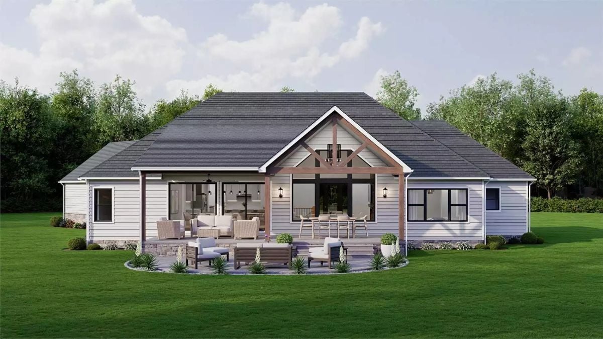 Covered Porch with Timber Gable Framing Anchors the Backyard