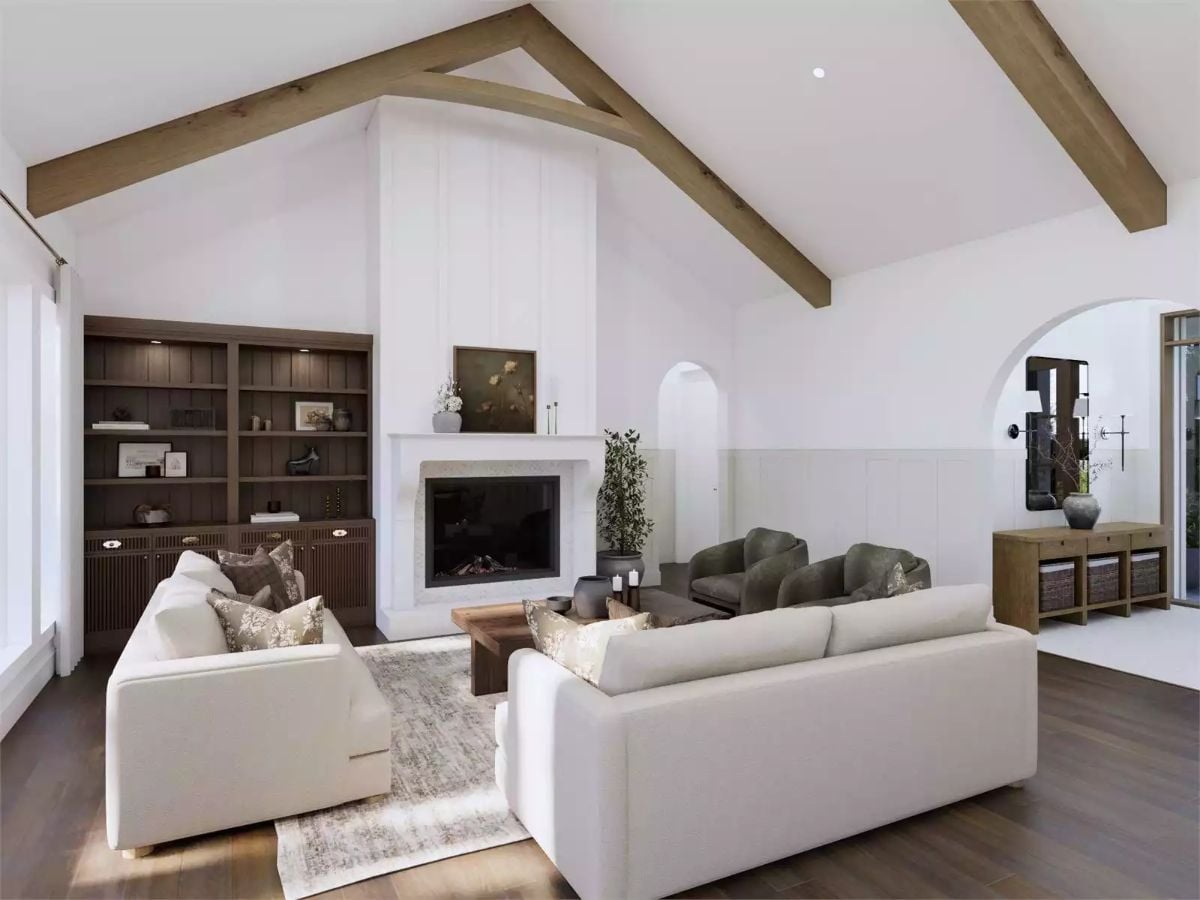 Vaulted Ceilings and Exposed Beams Ground This Warm, White Living Room
