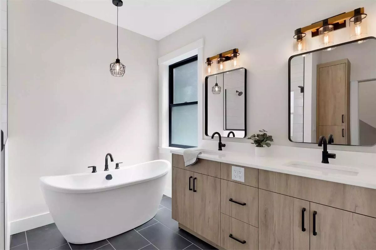 Freestanding Tub Gets Its Own Pendant in This Spa-Style Primary Bath