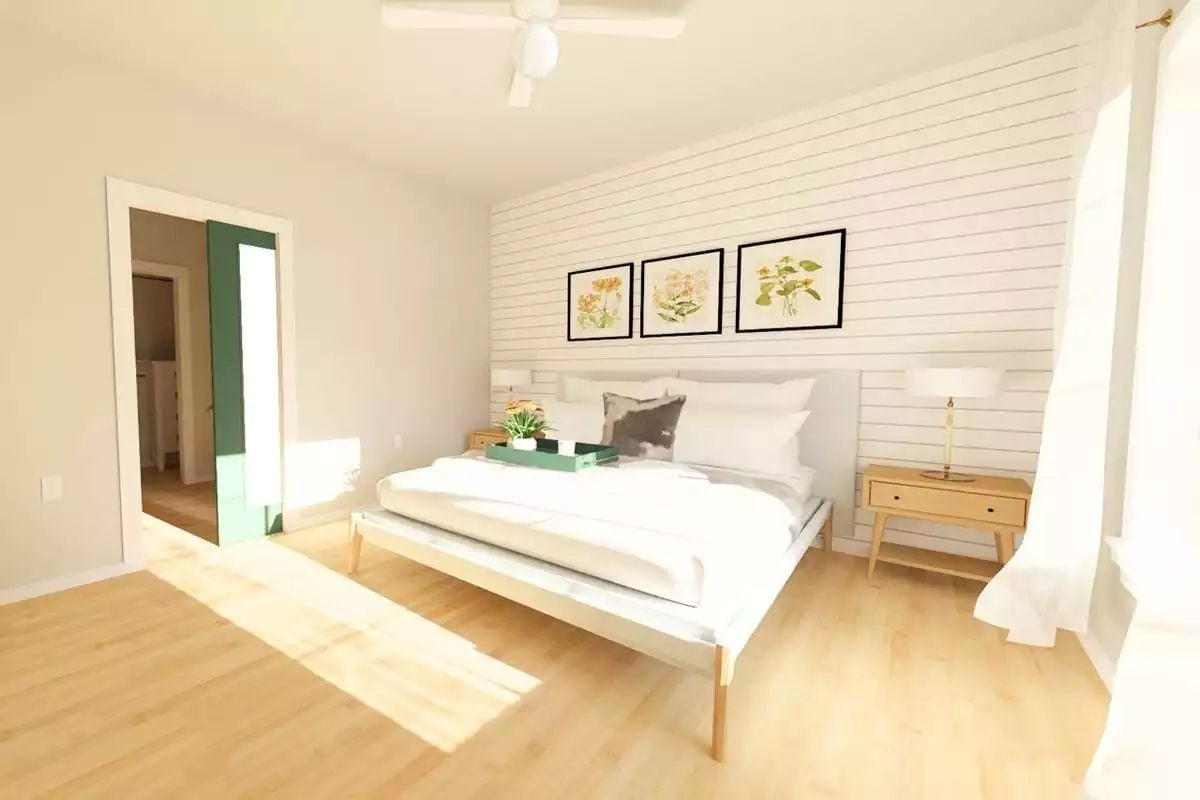 Shiplap Accent Wall and Botanical Prints Keep This Bedroom Grounded