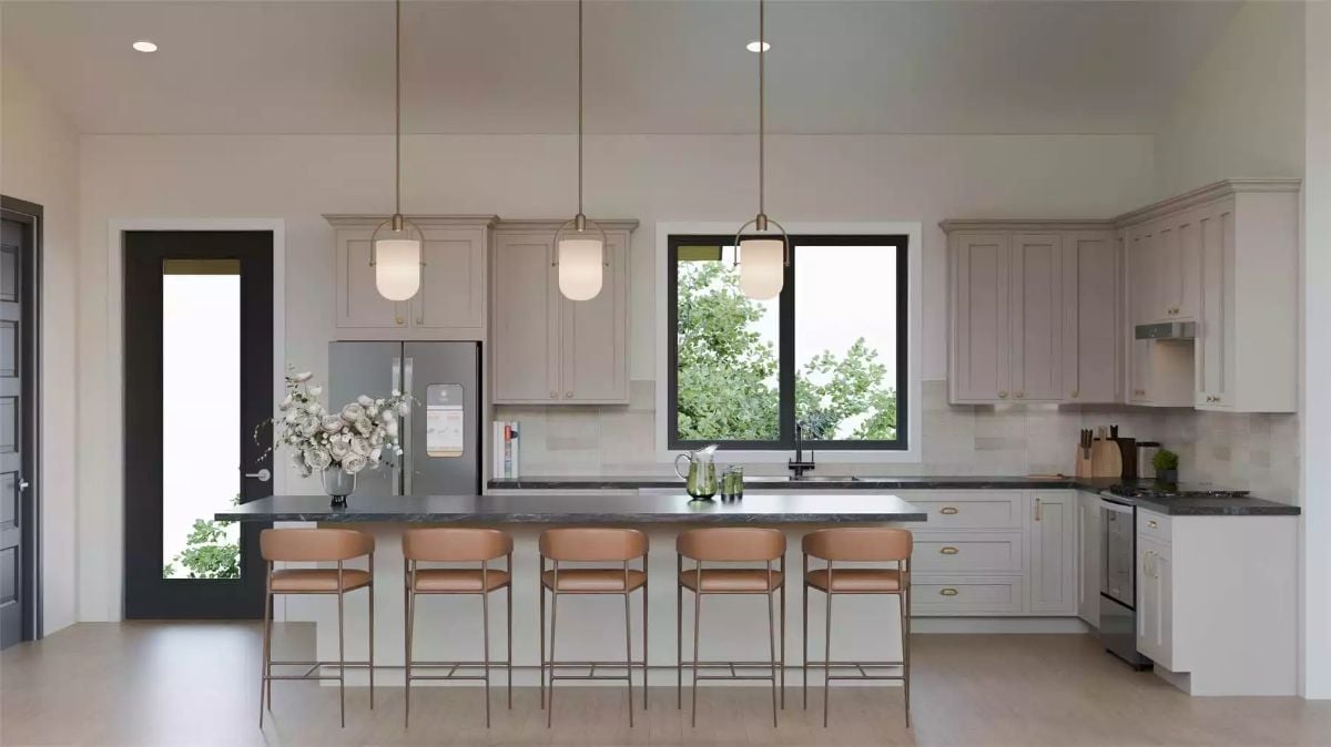 Warm Leather Barstools Against Dark Stone Make This Kitchen Worth Coming Home To