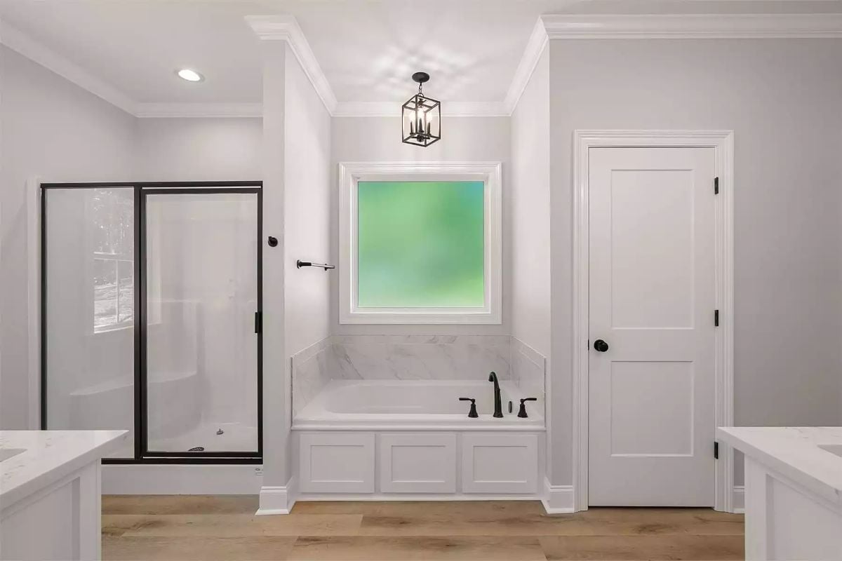 Marble Surround, Black Fixtures, and a Soaking Tub That Earns Its Square Footage