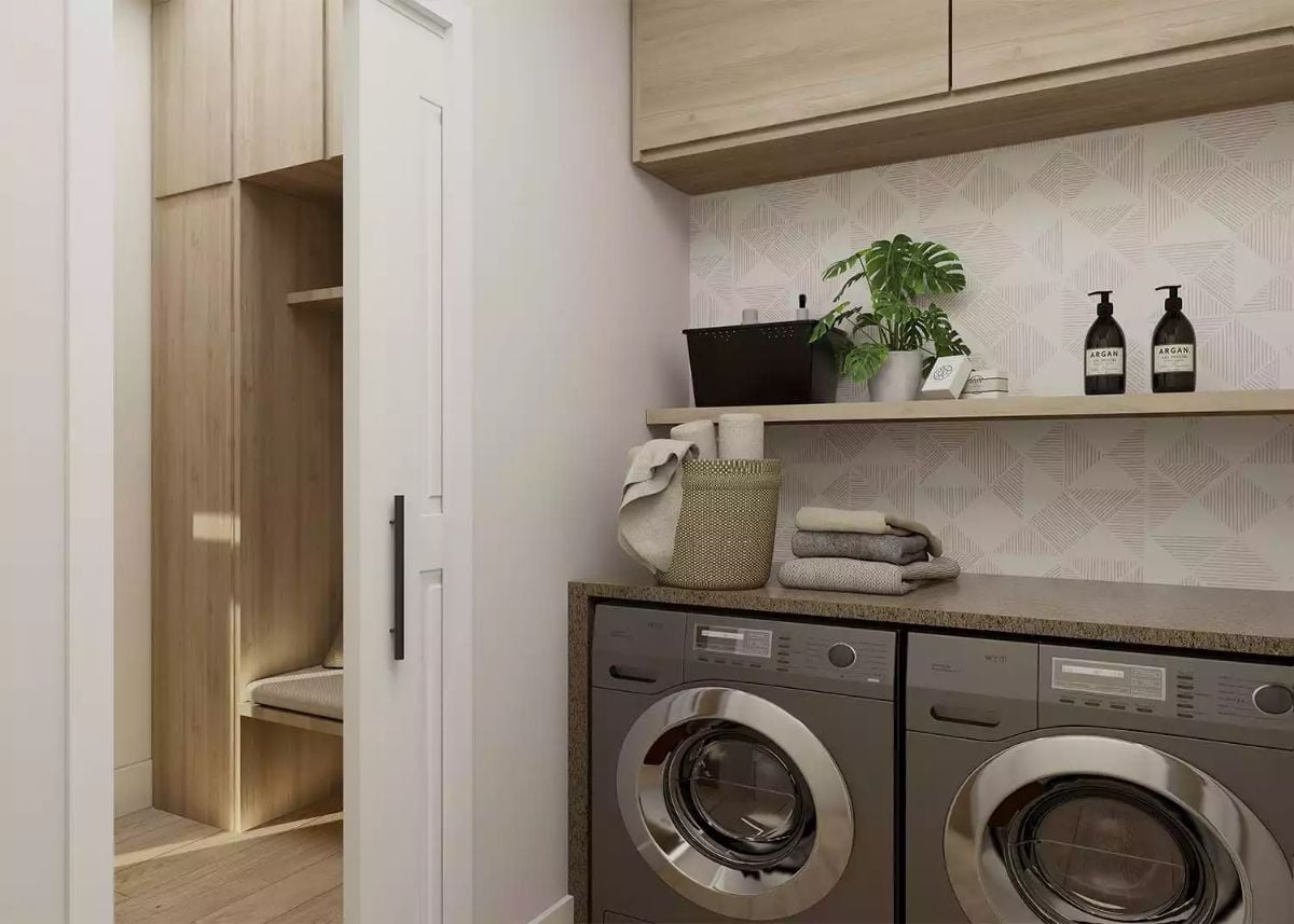 Side-by-Side Machines and a Granite Countertop Make Laundry Feel Less Like a Chore